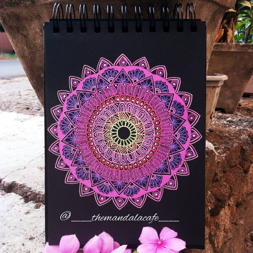 Mandala drawn on black background