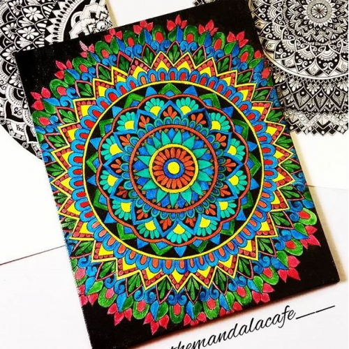 Vintage art, mandala hand drawn on black background