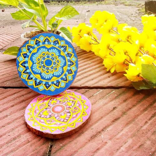 Mandala painted on wood slice coasters